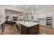 Spacious kitchen with large island, stainless steel appliances, and white cabinets at 6429 S Honor Ct, Gilbert, AZ 85298