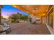 Covered patio with string lights, seating area, and backyard view at 6429 S Honor Ct, Gilbert, AZ 85298