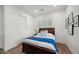 Guest bedroom with a double bed and wood floors at 6429 S Honor Ct, Gilbert, AZ 85298