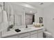 Modern bathroom with a white vanity, quartz countertops, and a shower at 6429 S Honor Ct, Gilbert, AZ 85298