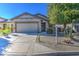 One-story home with a two-car garage and desert landscaping at 697 W Twin Peaks Pkwy, San Tan Valley, AZ 85143