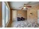 Relaxing bedroom with two chairs and backyard access at 697 W Twin Peaks Pkwy, San Tan Valley, AZ 85143