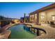 Freeform pool and spa with surrounding patio and landscape at 13051 N 145Th Way, Scottsdale, AZ 85259