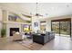 Spacious living room featuring a fireplace, large windows, and comfortable seating at 16349 E Links Dr, Fountain Hills, AZ 85268