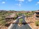 Aerial view of community entrance with curved road and mountain views at 16349 E Links Dr, Fountain Hills, AZ 85268