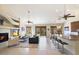 Open living area with fireplace, high ceilings, and sliding glass doors leading to a balcony at 16349 E Links Dr, Fountain Hills, AZ 85268