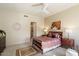 Spacious bedroom with floral bedding and ensuite bathroom access at 16349 E Links Dr, Fountain Hills, AZ 85268