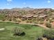 Aerial view of community with multiple residential homes near a golf course at 16349 E Links Dr, Fountain Hills, AZ 85268