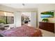 Primary bedroom with access to living room and golf course view at 16349 E Links Dr, Fountain Hills, AZ 85268