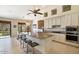 Modern kitchen with granite island and stainless steel appliances at 16349 E Links Dr, Fountain Hills, AZ 85268