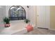 Relaxing bathroom featuring a large tub and arched window at 37206 N Tom Darlington Dr # 6, Carefree, AZ 85377