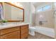 Clean bathroom with single vanity, bathtub and window at 19926 N Organ Pipe Dr, Surprise, AZ 85374