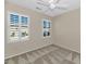 Well-lit bedroom featuring carpeted floors and window shutters at 19926 N Organ Pipe Dr, Surprise, AZ 85374