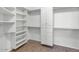 Large walk-in closet with ample shelving and drawers at 19926 N Organ Pipe Dr, Surprise, AZ 85374