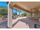Covered patio with ceiling fan, offering views of the backyard and desert landscaping at 19926 N Organ Pipe Dr, Surprise, AZ 85374