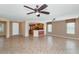 Open living room with view of kitchen and tile floors at 19926 N Organ Pipe Dr, Surprise, AZ 85374