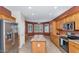 Bright kitchen with wood cabinets, stainless steel appliances, and an island at 19926 N Organ Pipe Dr, Surprise, AZ 85374