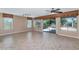 Spacious living room with tile floors and access to backyard at 19926 N Organ Pipe Dr, Surprise, AZ 85374