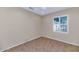 Simple bedroom with tile flooring and window shutters at 19926 N Organ Pipe Dr, Surprise, AZ 85374