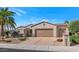 House exterior featuring a two-car garage and desert landscaping at 19926 N Organ Pipe Dr, Surprise, AZ 85374