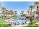 Community pool with lounge chairs and umbrellas at 19926 N Organ Pipe Dr, Surprise, AZ 85374