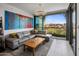 Living room features a sectional sofa, coffee table, and large windows at 7180 E Kierland Blvd # 314, Scottsdale, AZ 85254