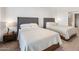 Two twin beds in a well-lit bedroom with modern nightstands at 7180 E Kierland Blvd # 314, Scottsdale, AZ 85254