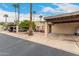 View of the home's exterior, showing the carport and landscaping at 443 S Boojum Way, Mesa, AZ 85208