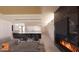 Sophisticated living area featuring a fireplace and ample natural light at 6612 E Hummingbird Ln, Paradise Valley, AZ 85253