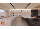 Modern kitchen with large island, stainless steel appliances, and custom cabinetry at 6612 E Hummingbird Ln, Paradise Valley, AZ 85253