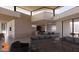 Open living room showcasing a modern kitchen, breakfast bar, and comfortable seating at 6612 E Hummingbird Ln, Paradise Valley, AZ 85253