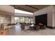Spacious living area with a fireplace, comfortable seating, and access to backyard at 6612 E Hummingbird Ln, Paradise Valley, AZ 85253