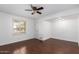 Bright bedroom with hardwood floors and ceiling fan at 8307 E Vista De Valle --, Scottsdale, AZ 85255