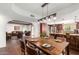 Rustic dining area with farmhouse table and view to the kitchen at 8307 E Vista De Valle --, Scottsdale, AZ 85255