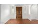 Interior entryway with a carved wooden door and hexagonal tile floor at 8307 E Vista De Valle --, Scottsdale, AZ 85255