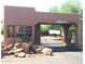 Gated community entrance with stone accents at 8307 E Vista De Valle --, Scottsdale, AZ 85255
