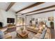 Bright living room with hardwood floors, fireplace, and view to backyard at 8307 E Vista De Valle --, Scottsdale, AZ 85255