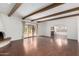 Living room with hardwood floors, exposed beams, and a fireplace at 8307 E Vista De Valle --, Scottsdale, AZ 85255