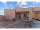 Tan stucco exterior with private patio and walkway at 35916 N 213Th Dr, Wittmann, AZ 85361