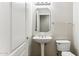 Clean bathroom with pedestal sink, toilet and mirrored medicine cabinet at 19435 N 62Nd Ave, Glendale, AZ 85308