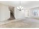 Bright and spacious entryway with tiled floors and elegant chandelier at 19435 N 62Nd Ave, Glendale, AZ 85308