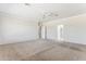 Large bedroom with plush carpeting and access to bathroom at 19435 N 62Nd Ave, Glendale, AZ 85308