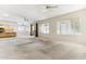 Open and airy living room with views to the kitchen and backyard access at 19435 N 62Nd Ave, Glendale, AZ 85308