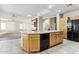 Large kitchen island with seating and a convenient workspace at 19435 N 62Nd Ave, Glendale, AZ 85308