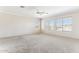 Bright bedroom featuring neutral walls, carpet, and large windows at 19435 N 62Nd Ave, Glendale, AZ 85308
