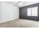 Bright bedroom with neutral walls, carpet flooring, and a ceiling fan at 19435 N 62Nd Ave, Glendale, AZ 85308