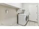 Laundry room with washer, dryer, and built-in shelving at 19435 N 62Nd Ave, Glendale, AZ 85308