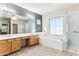 Elegant bathroom with double vanity, soaking tub and walk-in shower at 19435 N 62Nd Ave, Glendale, AZ 85308