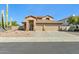 Two-story house with a three-car garage and desert landscaping at 19435 N 62Nd Ave, Glendale, AZ 85308