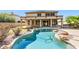 Freeform swimming pool and expansive patio area at 19435 N 62Nd Ave, Glendale, AZ 85308